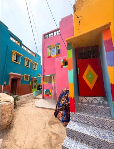 A colorful lane between bright houses in Aghroud